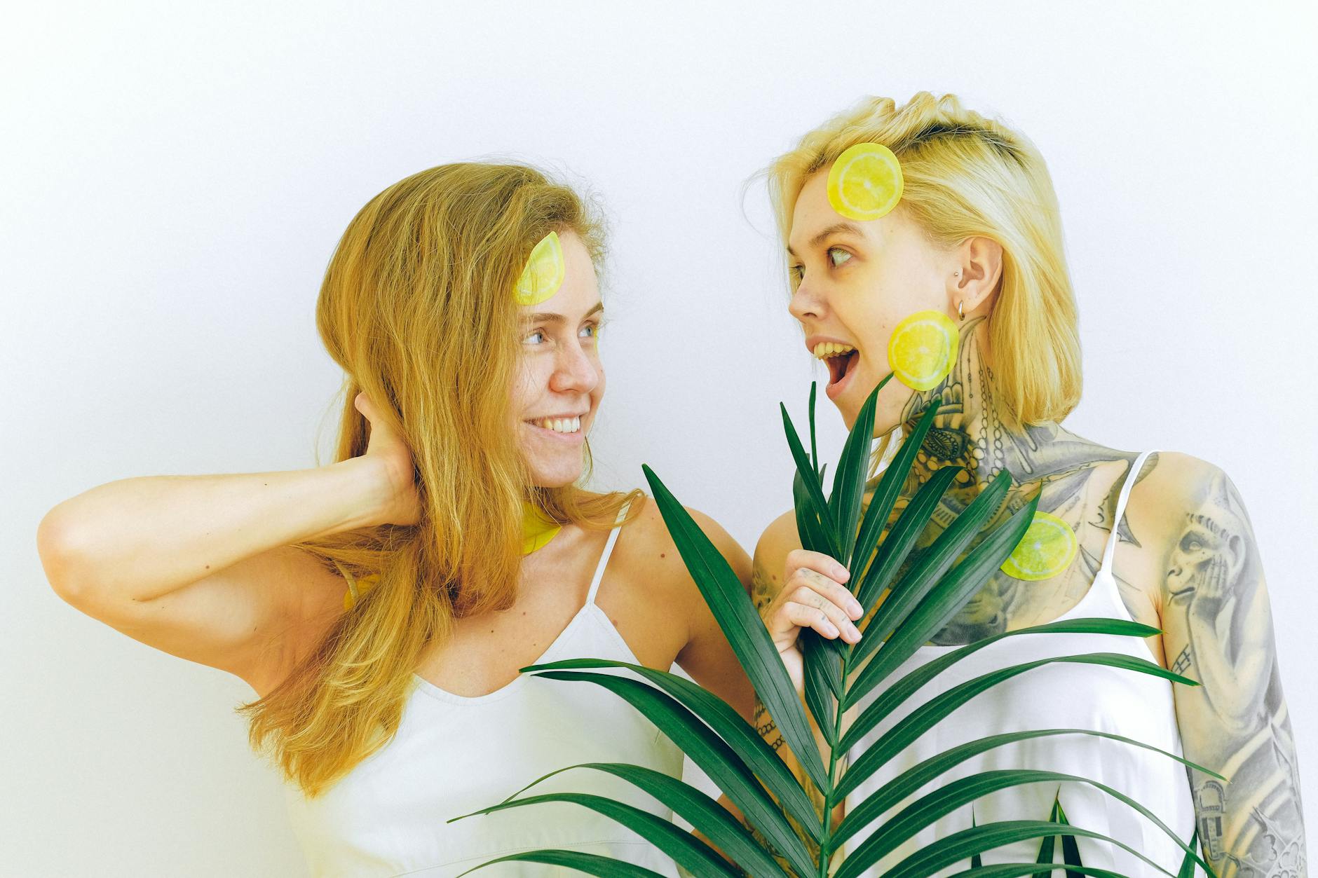 Two women smiling joyfully together, embodying confidence and freedom in midlife